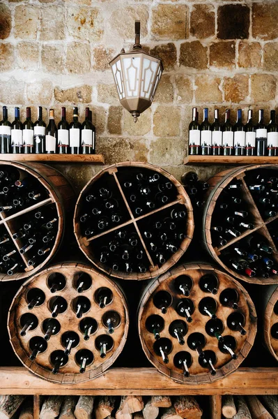 Store of old bottles of wine in cellar. Close up. — Stock Photo, Image