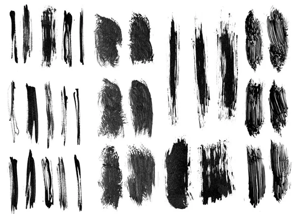 Pincel grunge tinta preta definir traços no fundo branco . — Fotografia de Stock