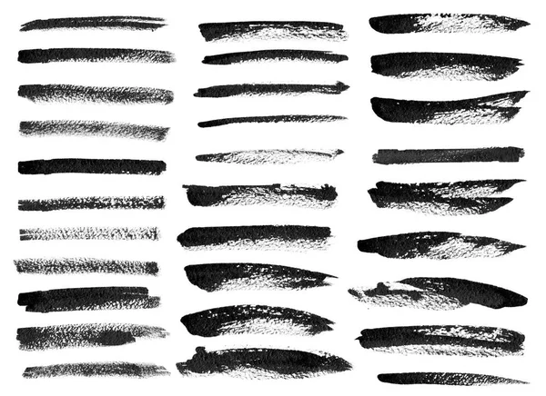Черные чернила гранж кисти установить штрихи на белом фоне . — стоковое фото