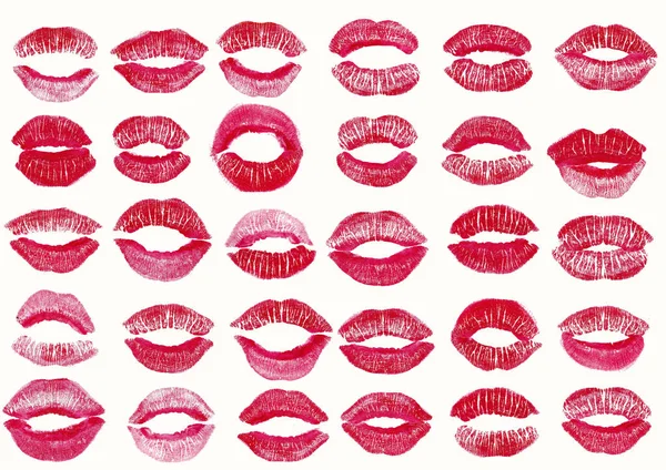 Set with pink color lipstick kiss marks on white background. — Stock Photo, Image