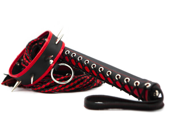 Sex toys for bdsm. Leather whip and collar with spikes isolated on white background