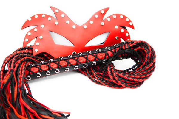 Sex toys for bdsm. Leather whip and red mask isolated on white background. Sex toy for intimate perversions. Sex slavery.