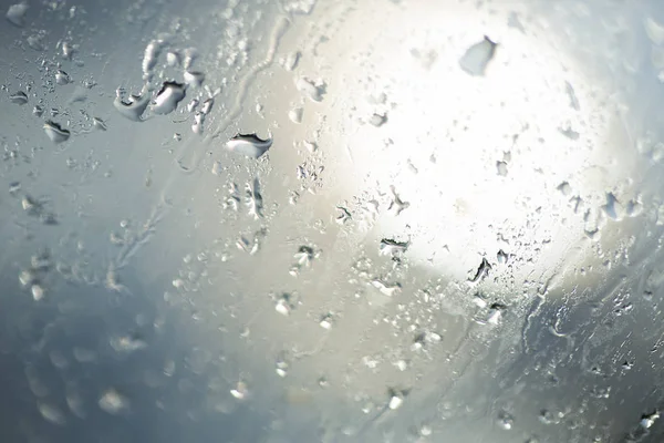 Rain drop at surface of a car. Water drop background.