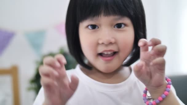 Slow Motion Happy Little Asian Girl Who Pretend Monster Making — Stock Video