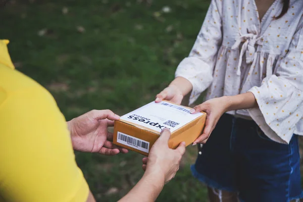 stock image Young Asian Delivery man delivering packages to customer