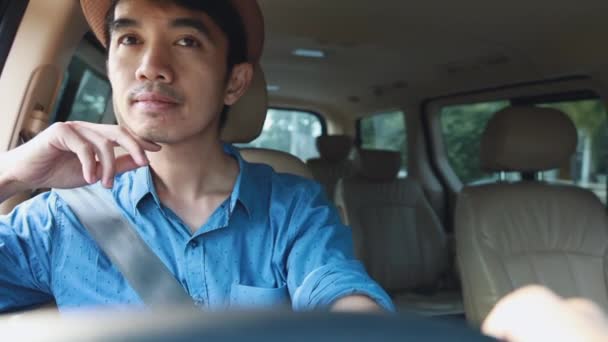 Medium Shot Happy Asian Man Driving Car Looking — Stock Video