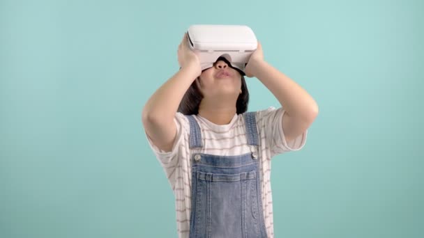 Asian Girl Virtual Reality Glasses Playing Virtual Game Blue Green — Stock Video