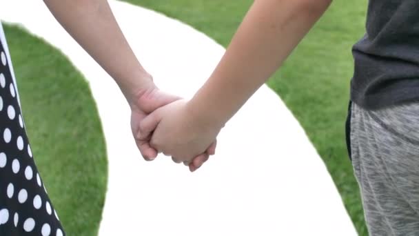 Asian Mother Holding Hand Son Outdoors Medium Shot Focused Hand — Stock Video