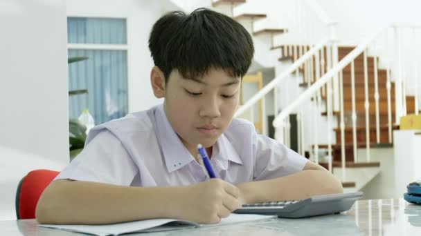 Slow Motion Asian Boy Doing Homework White Table Serious Asian — Stock Video
