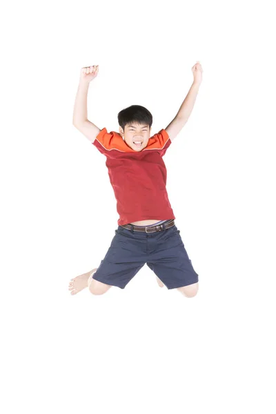 Asian funny child boy jumping on white background. — Stock Photo, Image