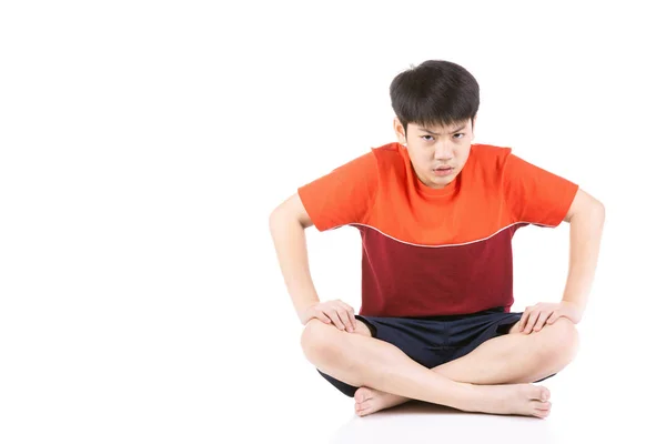 Retrato Jovem asiático irritado menino sentado sobre fundo branco , — Fotografia de Stock