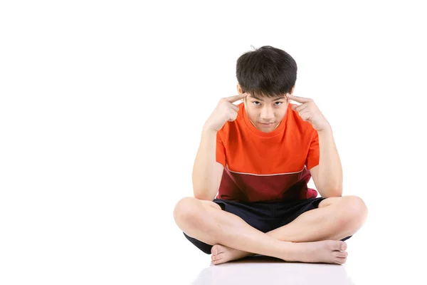 Portrait Young Asian boy sitting over white background, — Stock Photo, Image