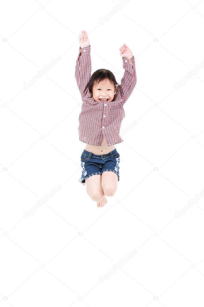 Portrait of happy little Asian child jumping isolated on white 