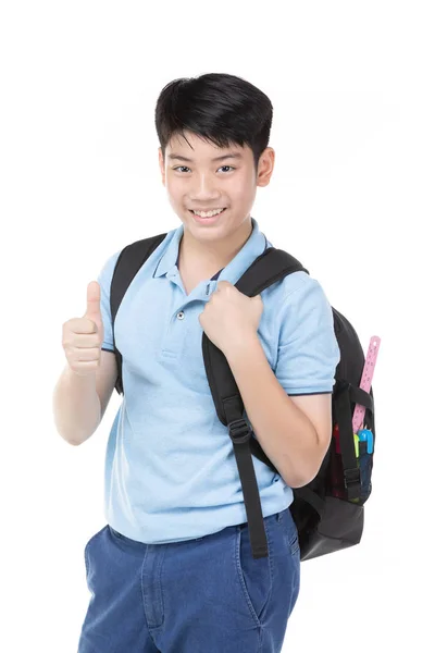 Sorridente piccolo studente ragazzo in blu polo t-shirt con libri e — Foto Stock