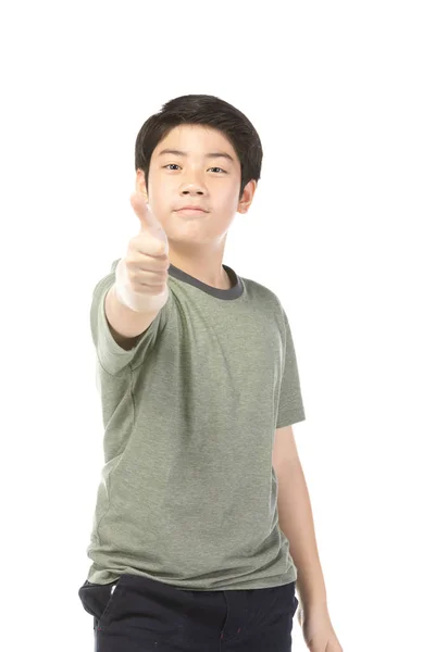 Asian excited boy in green-shirt giving thumbs-up. — Stock Photo, Image