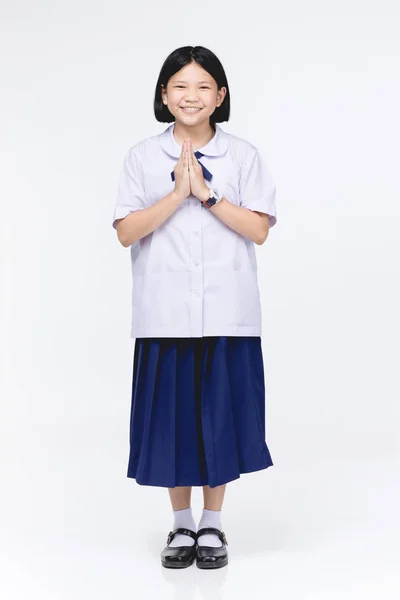 Asiatisk barn flicka i elevens uniform, tillförordnad Sawaddee betyder Hell — Stockfoto