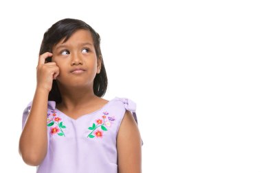 Cute asian dark little girl thinking emotion on face . clipart