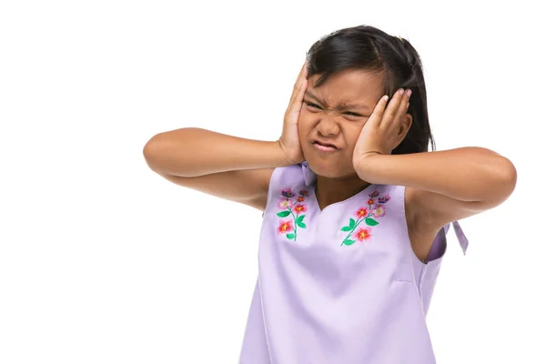 Cute asian dark little girl making a funny emotion on face . — Stock Photo, Image