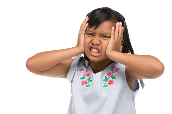 Cute asian dark little girl making a funny emotion on face . — Stock Photo, Image