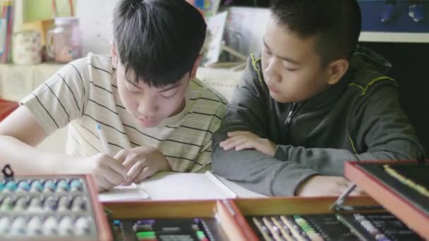 Happy Little Boy Doing Your Homework Child Sitting Desk Home — Stock Video