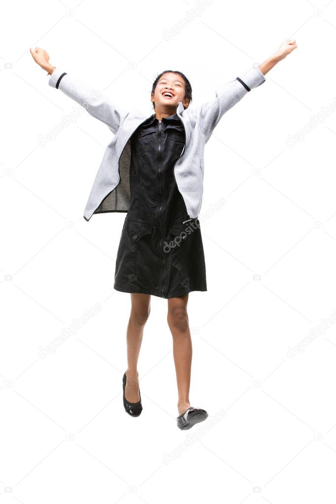 Portrait of Black asian child jumping isolated on white .