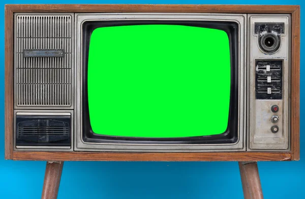 Vintage Retro Style old television with cut out screen, old television on blue background. Television with green screen.