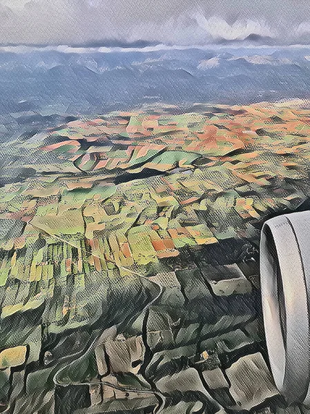 View from a plane onto fields and mountains, illustrated and artistic picture in the style of a painted canvas