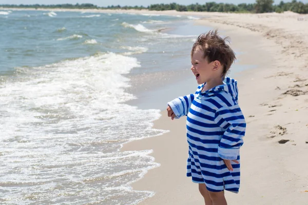 Kid Stands Happy Sea Background Beach Striped Robe Looks Distance — Stock Photo, Image
