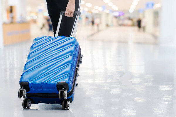 Traveler women and luggage at airport terminal Travel concept