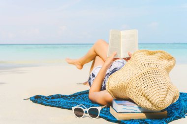 Summer Beach Holiday Woman reading a book on the beach in free t