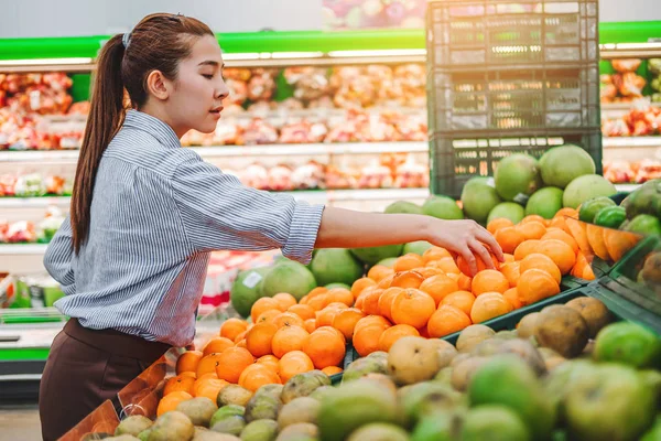 Asian women shopping Healthy food vegetables and fruits in super