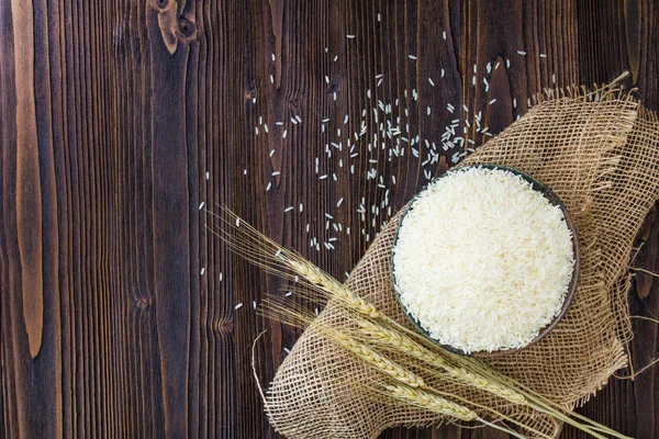 Weißer Reis Schüssel Und Reisohren Auf Holztisch — Stockfoto