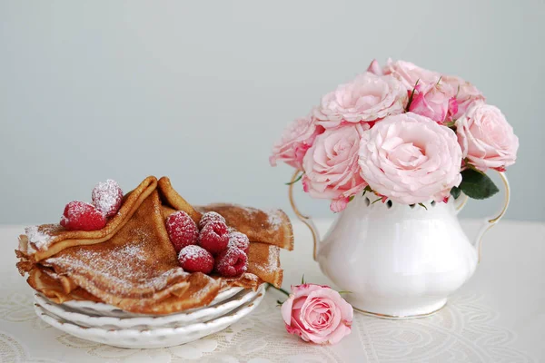 still life of roses, pancakes and flowers