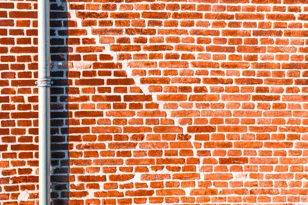 Abstract Red Brick Texture With Pipe