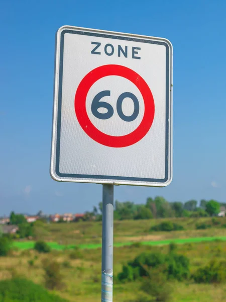 Dutch road sign: speed limit 60