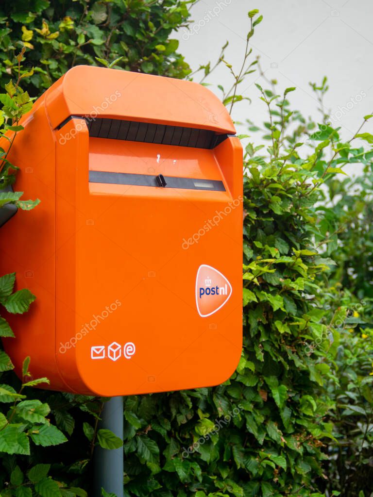 RESSEN, GELDERLAND, SEPTEMBER 9 2020: The Famous orange Post.nl Post Box for the Dutch post