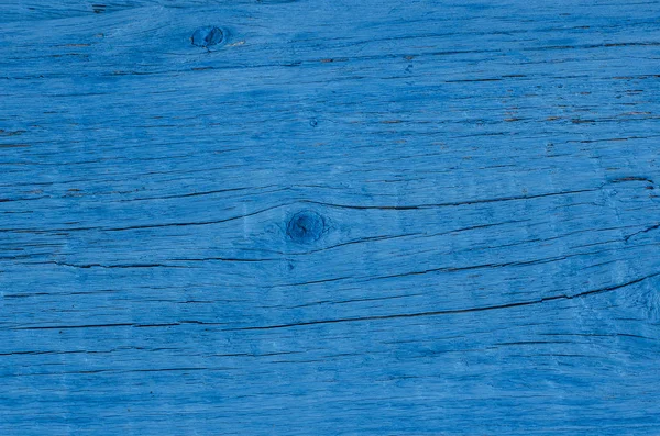 A textura da tinta azul rachada em placas de madeira . — Fotografia de Stock