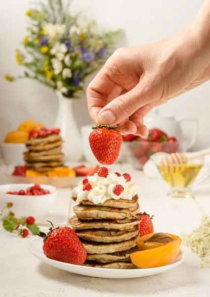 Pancakes Strawberries Delicious Breakfast Woman Decorates Strawberries Stack Pancakes Whipped — Stock Photo, Image