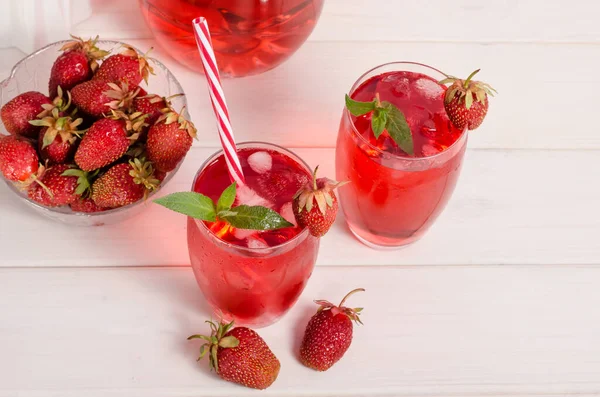 Summer cool drink with strawberries and ice. Horizontal photo