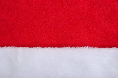 Noel Baba şapkası kırmızı kumaş ve beyaz kürk deseni. Yeni yıl ve Noel geçmişi. Tasarım için.