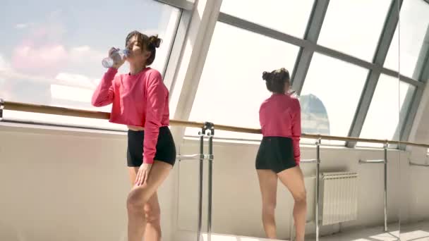 Beautiful Caucasian Brunette Pink Sportswear Drinking Water Bottle White Room — Stock Video