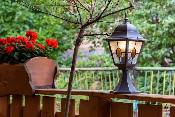 Shining lamp in a garden — Stock Photo, Image