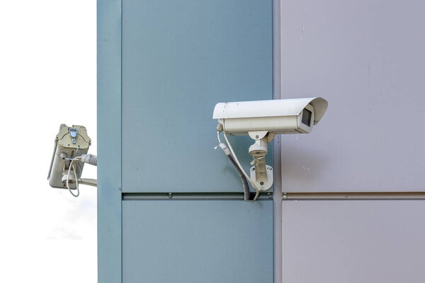 two video surveillance cameras at the end of the building