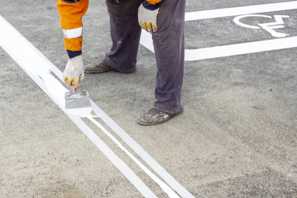 marking in the parking lot. Disabled person parking place permit mark on the asphalt road. Road marking symbol on road