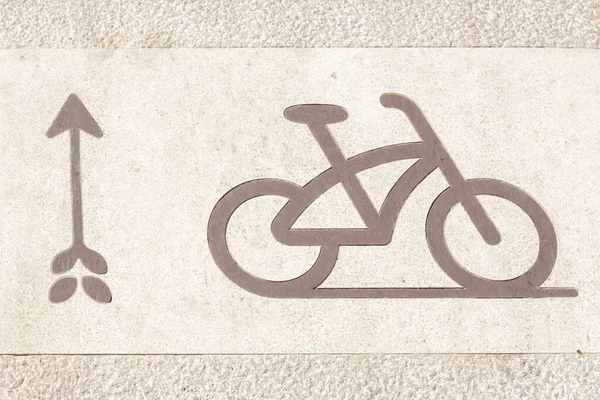 Bicycle signs on the bicycle way in Park. Bicycle lane for bike rider. Cycling path in the city. Bicycle road sign