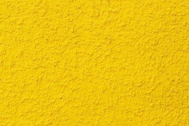 Sarı duvar dokusu arka plan. Sarı desenli alçı duvarın fotoğrafı..