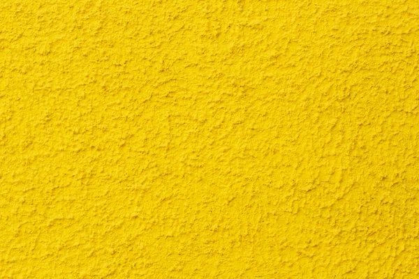 yellow wall texture background. Photo of yellow textured plaster wall.