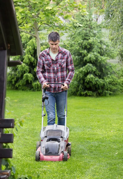 Handsome Young Man Trimming Grass Electric Mower Backyard Spring — Stock Photo, Image