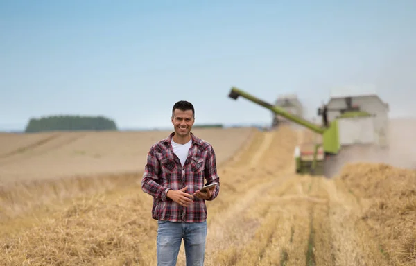 Smiling Handsome Farmer Tablet Standing Front Combine Harvester Harvest Field — Stock Photo, Image