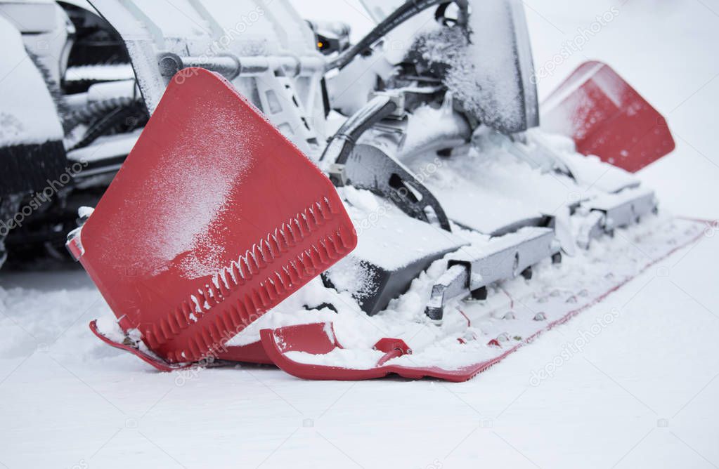 Close up of snowcat machine for ski slope preparation parked on snow